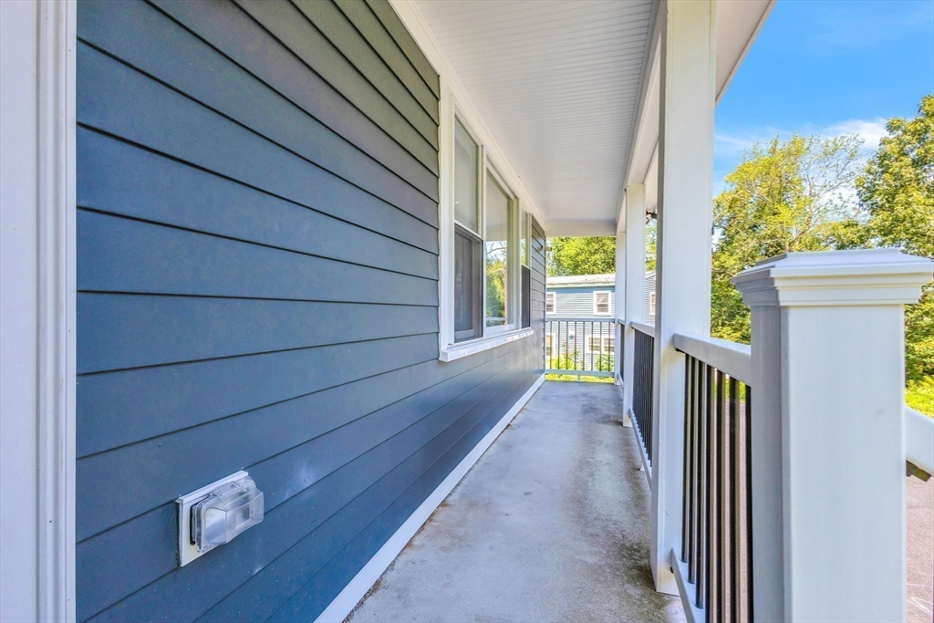 306 Berlin Road Marlborough, MA 01752 - Photo 21 of 36 a view of front door of house with wooden stairs