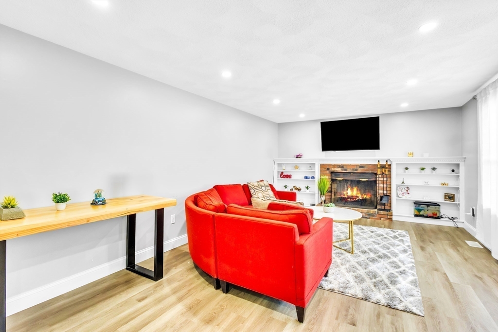306 Berlin Road Marlborough, MA 01752 - Photo 25 of 36 a living room with furniture and a flat screen tv