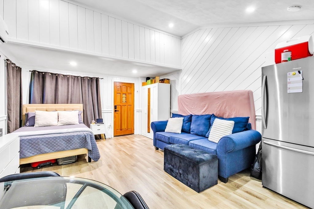 306 Berlin Road Marlborough, MA 01752 - Photo 26 of 36 a bedroom with a bed and a couch