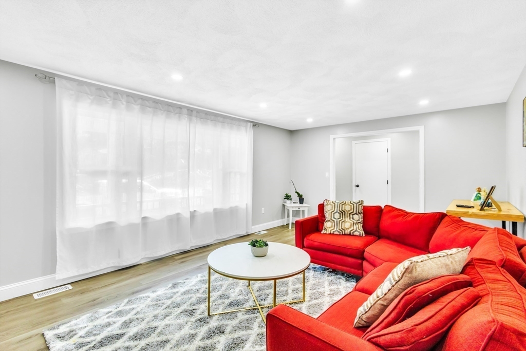 306 Berlin Road Marlborough, MA 01752 - Photo 27 of 36 a living room with furniture and a wooden floor