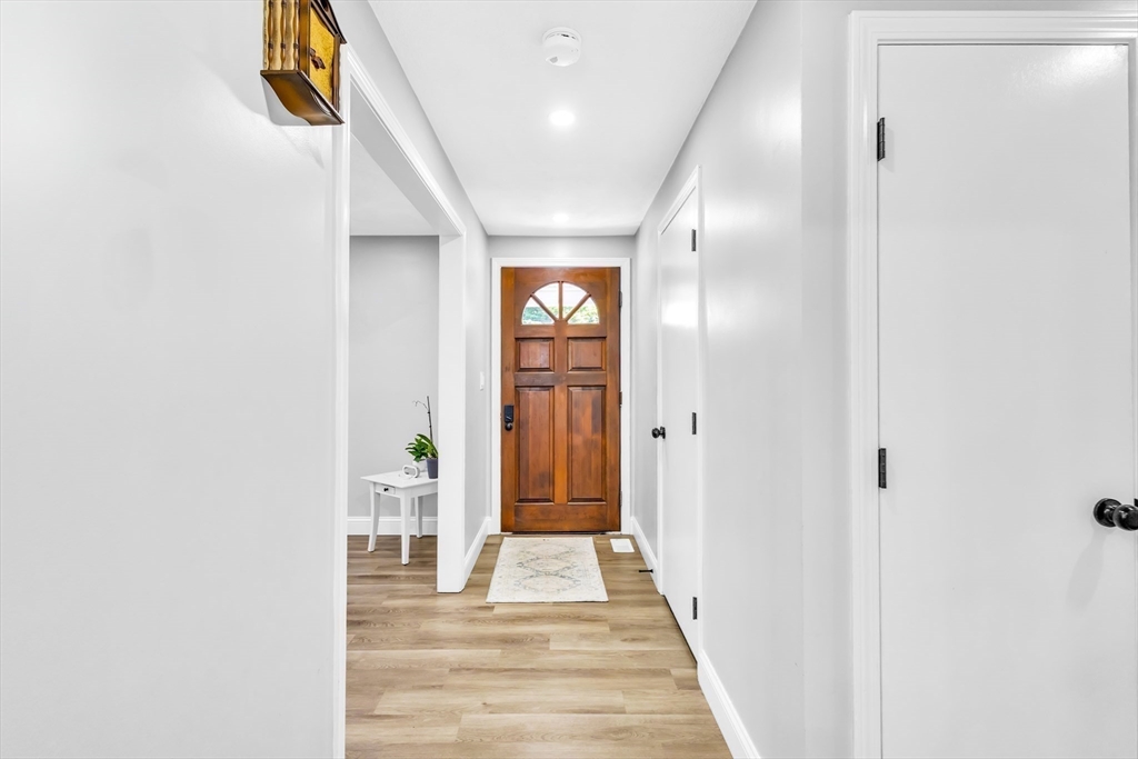 306 Berlin Road Marlborough, MA 01752 - Photo 28 of 36 a view of a hallway with wooden floor and entryway