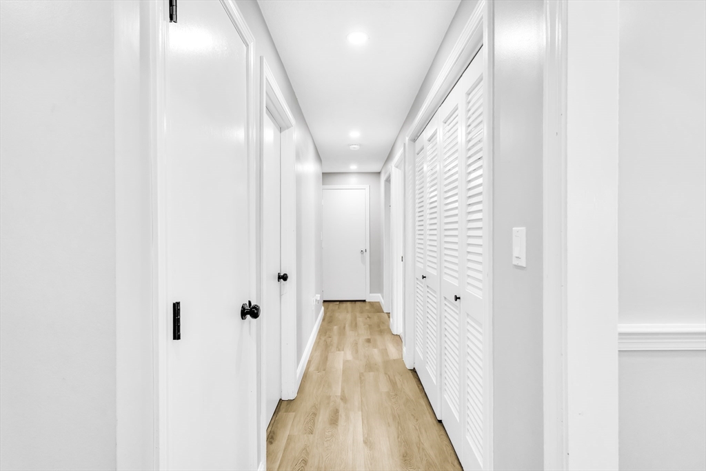 306 Berlin Road Marlborough, MA 01752 - Photo 29 of 36 a view of a hallway with wooden floor