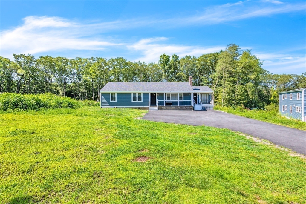 306 Berlin Road Marlborough, MA 01752 - Photo 30 of 36 a view of a house with pool and a yard