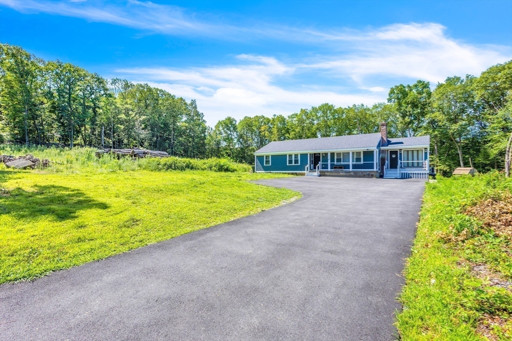 306 Berlin Road Marlborough, MA 01752 - Photo 31 of 36 a view of a house with a yard