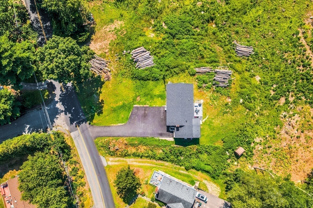 306 Berlin Road Marlborough, MA 01752 - Photo 32 of 36 an aerial view of a house with a yard