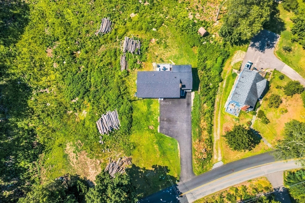306 Berlin Road Marlborough, MA 01752 - Photo 33 of 36 an aerial view of residential house with outdoor space and trees all around
