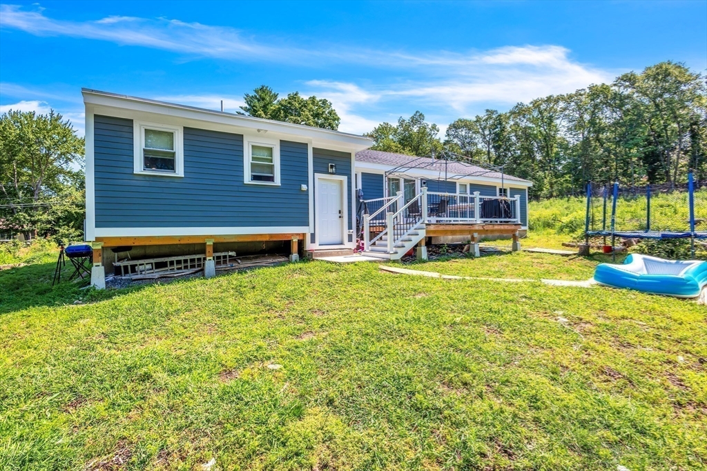 306 Berlin Road Marlborough, MA 01752 - Photo 34 of 36 a view of a house with a yard patio and swimming pool