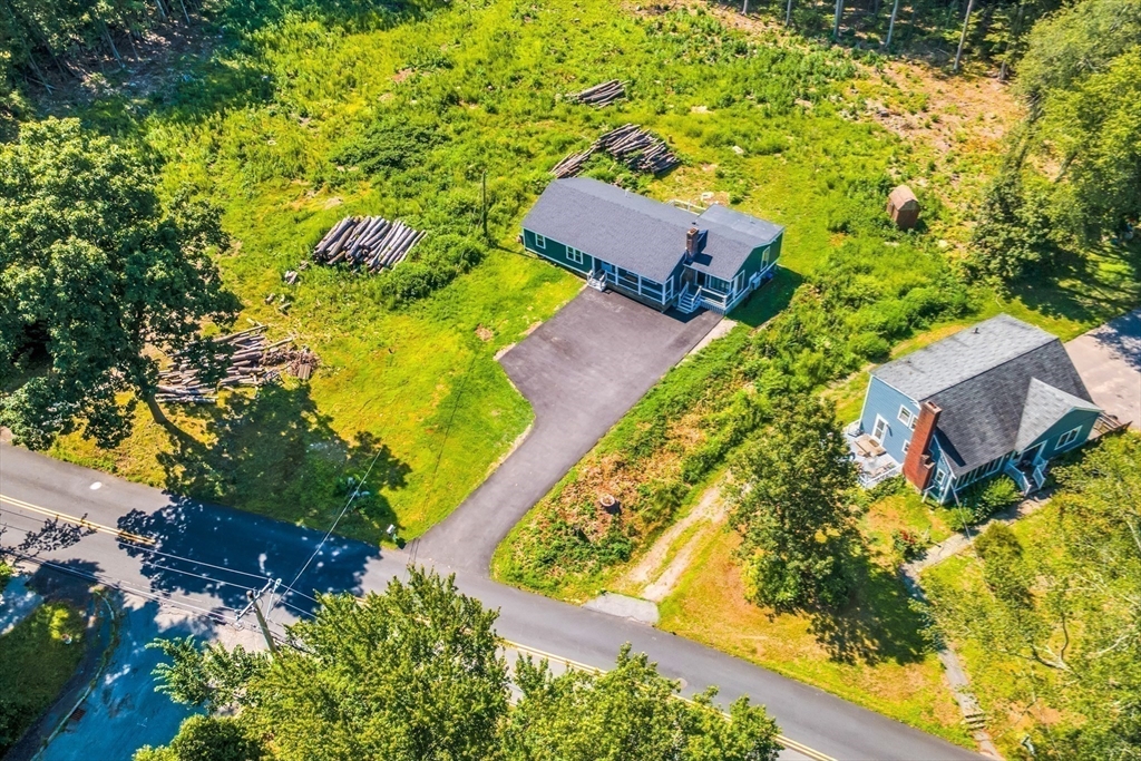 306 Berlin Road Marlborough, MA 01752 - Photo 36 of 36 an aerial view of a house with a yard