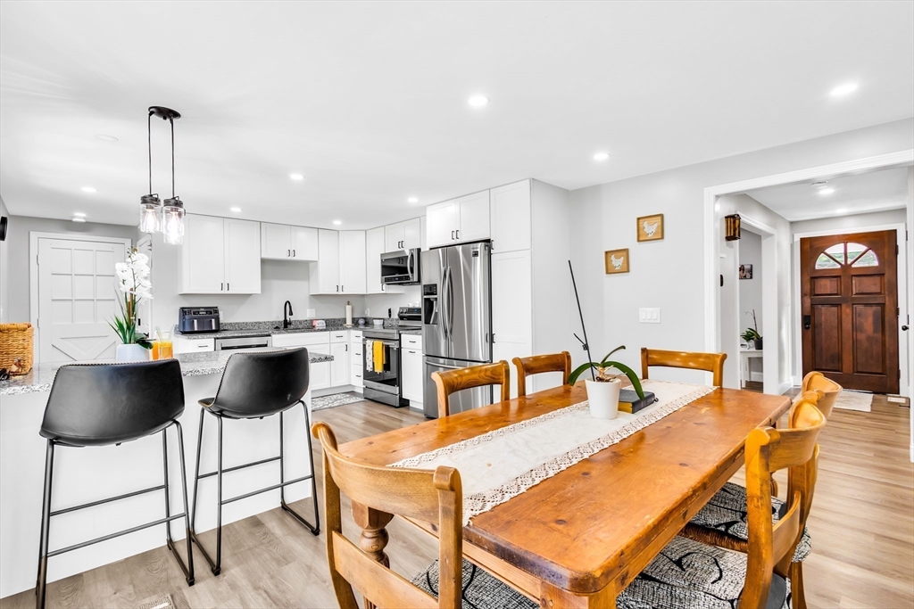 306 Berlin Road Marlborough, MA 01752 - Photo 5 of 36 a living room with stainless steel appliances kitchen island granite countertop furniture and a kitchen view