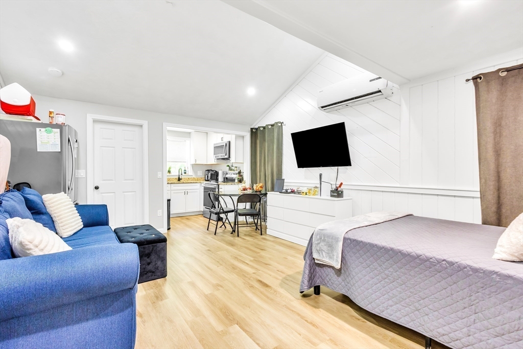 306 Berlin Road Marlborough, MA 01752 - Photo 6 of 36 a living room with furniture and a flat screen tv