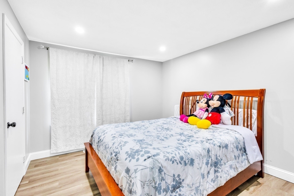 306 Berlin Road Marlborough, MA 01752 - Photo 8 of 36 a bedroom with a bed and painting on the wall