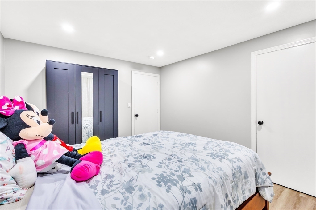 306 Berlin Road Marlborough, MA 01752 - Photo 9 of 36 a bedroom with a bed and a dresser