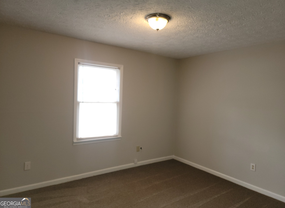 15 Greenview Drive McDonough, GA 30253 - Photo 24 of 26 an empty room with a window