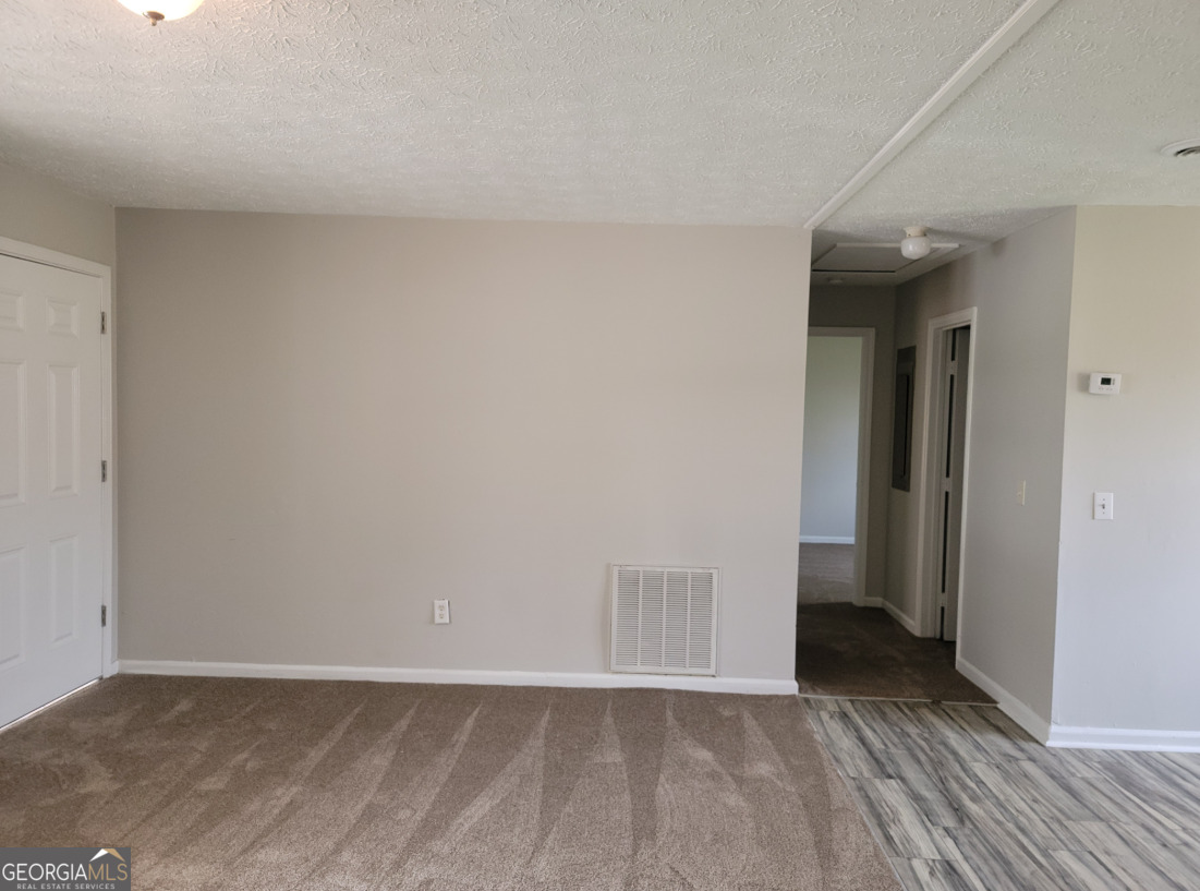 15 Greenview Drive McDonough, GA 30253 - Photo 8 of 26 a view of an empty room and wooden floor