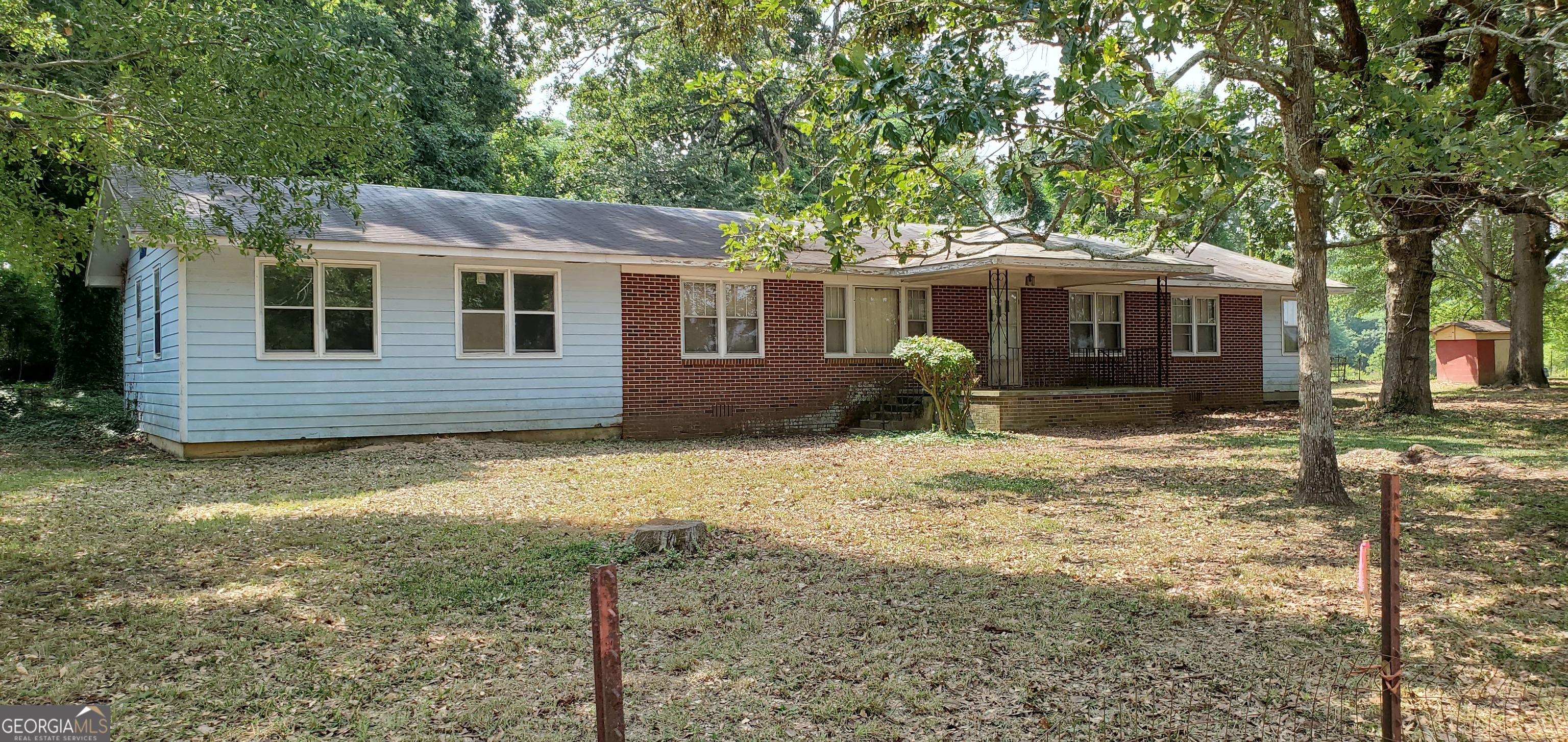1061 Burger Road Watkinsville, GA 30677 - Photo 1 of 43 a front view of a house with garden