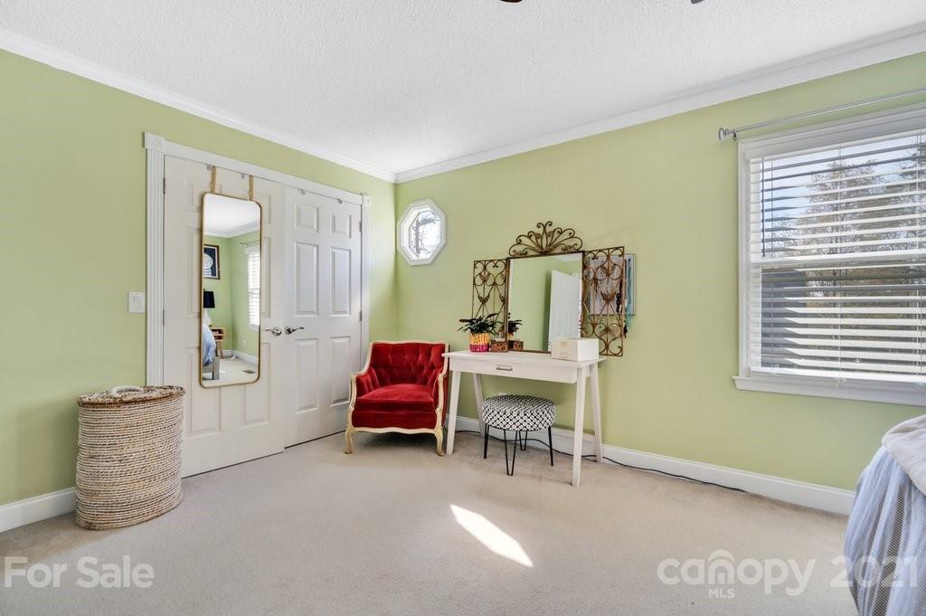 3080 Point Clear Drive Tega Cay, SC 29708 - Photo 12 of 23 a view of a bedroom with furniture and windows