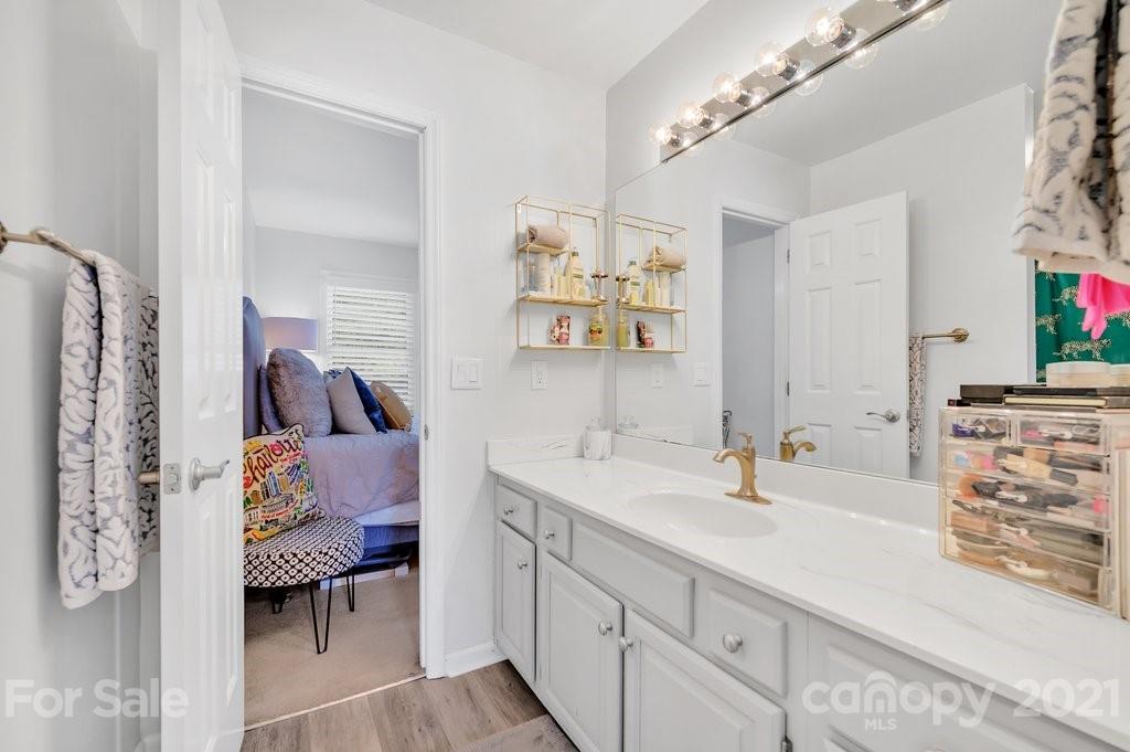 3080 Point Clear Drive Tega Cay, SC 29708 - Photo 15 of 23 a en suite bathroom with a double vanity sink and a mirror
