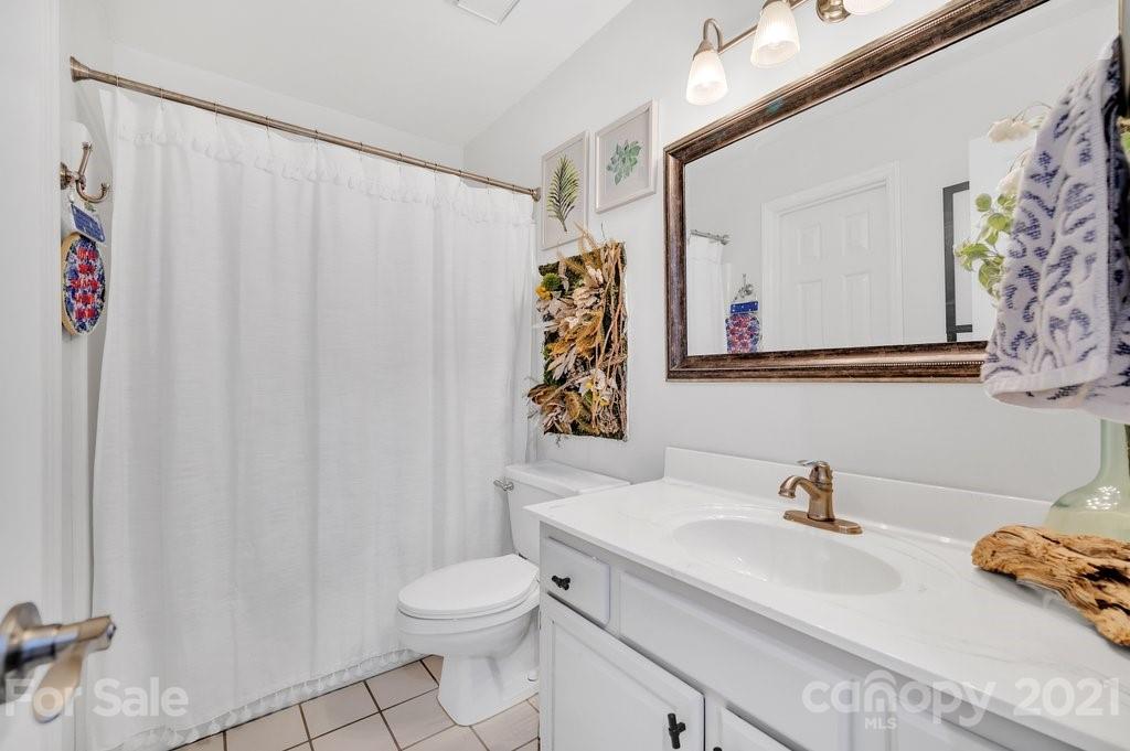 3080 Point Clear Drive Tega Cay, SC 29708 - Photo 17 of 23 a bathroom with a sink toilet and shower