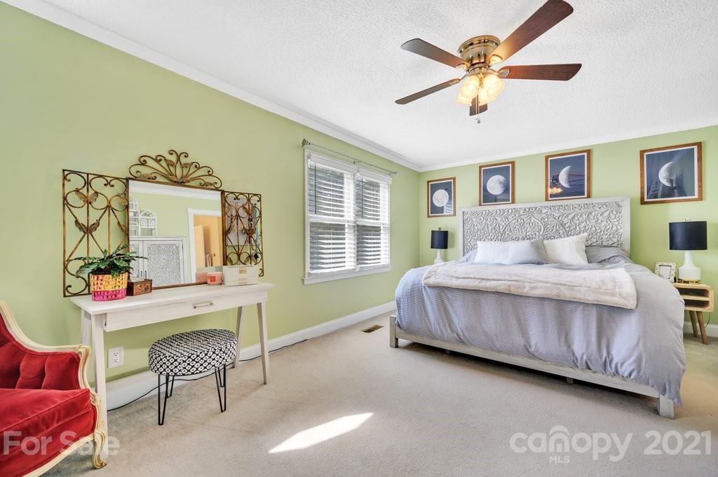 3080 Point Clear Drive Tega Cay, SC 29708 - Photo 10 of 23 a bedroom with a bed chair and a window