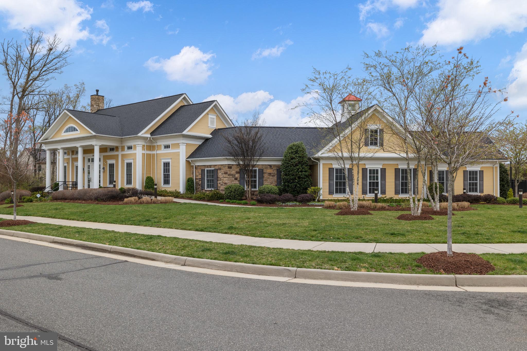 13635 Rockingham Lane Gainesville, VA 20155 - Photo 47 of 56 a front view of a house with a yard
