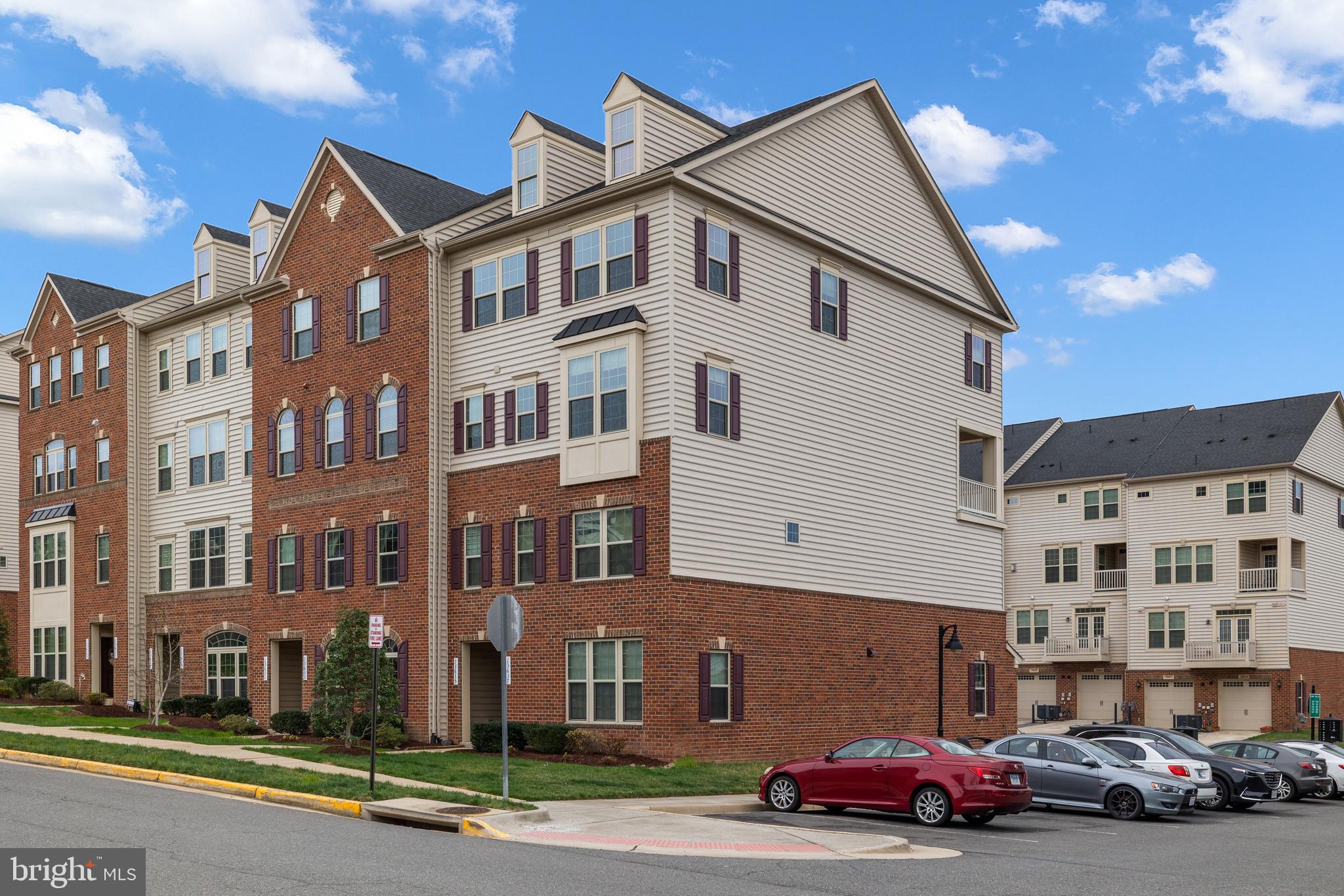13635 Rockingham Lane Gainesville, VA 20155 - Photo 6 of 56 a front view of a building with street view
