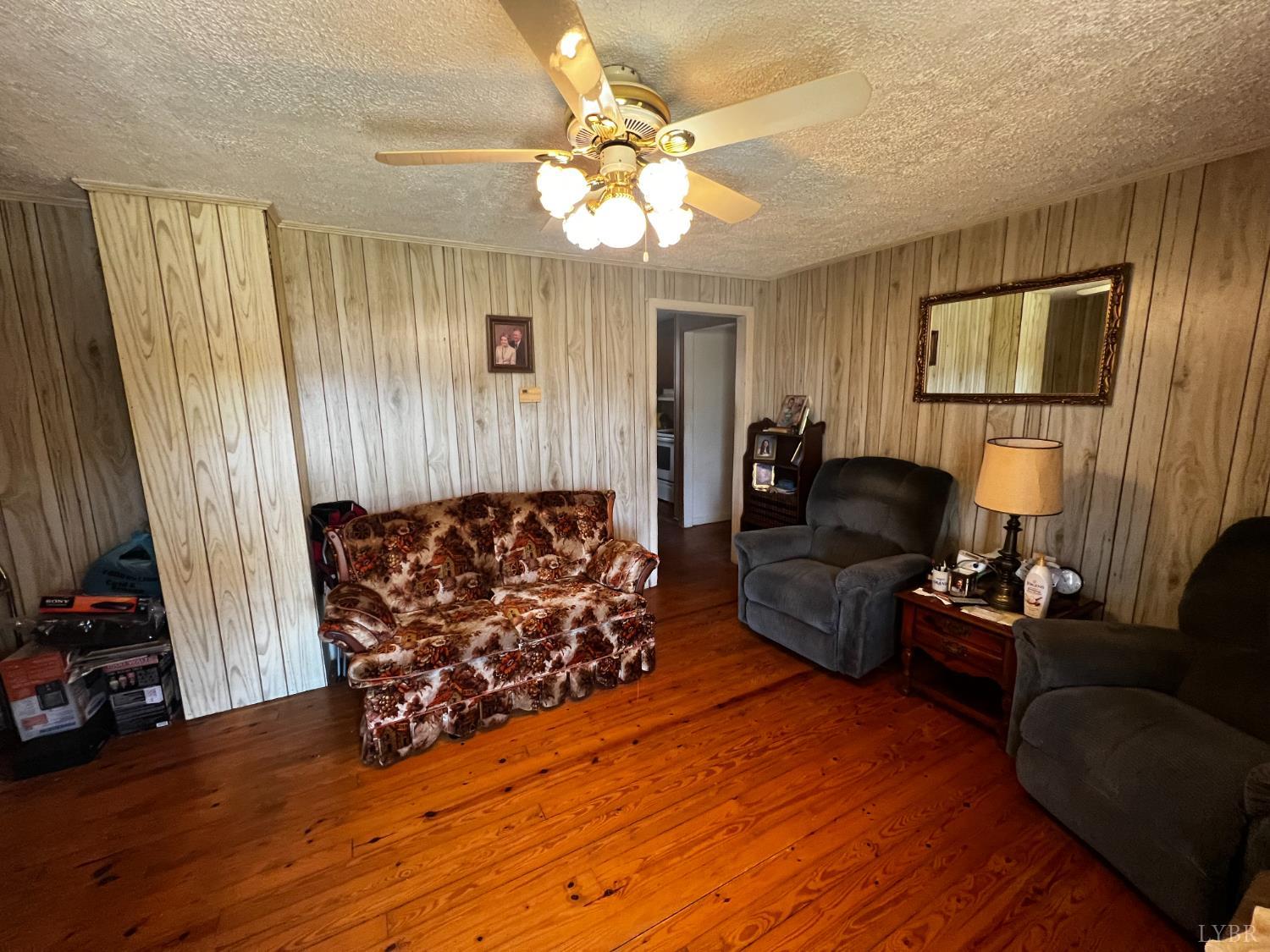 955 Peerman School Road Altavista, VA 24517 - Photo 3 of 7 a living room with furniture and a flat screen tv
