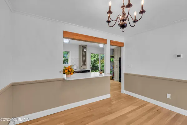 a view of a living room and chandelier