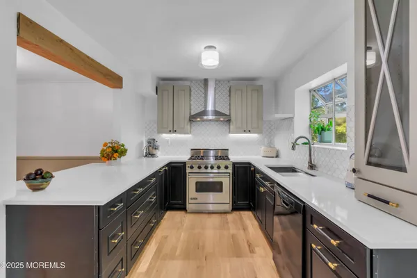 a kitchen with a sink stove and refrigerator