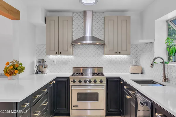 a kitchen with a stove and a sink