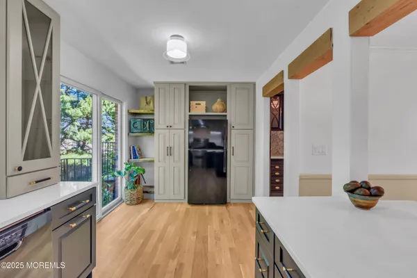 a kitchen that has a refrigerator and a sink