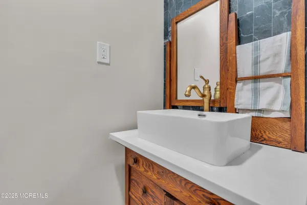 a bathroom with a bathtub and a window