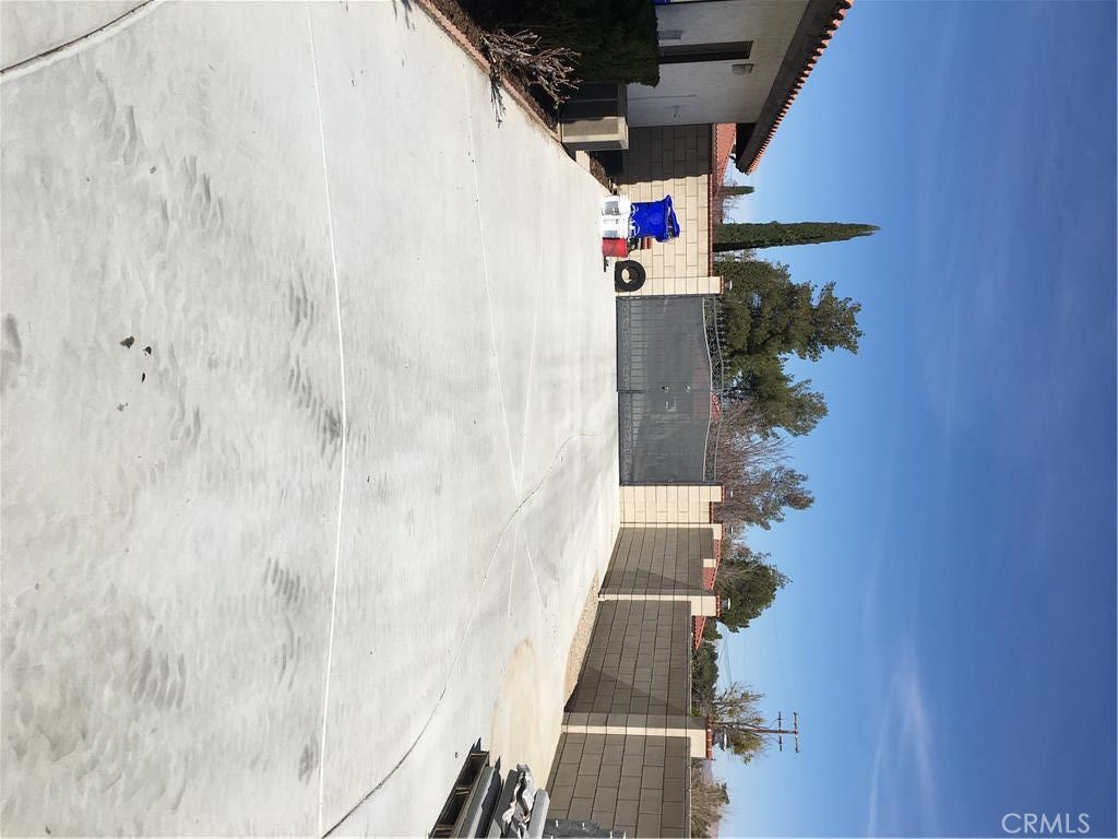 20231 Wadena Road Apple Valley, CA 92308 - Photo 20 of 20 a view of entryway with a potted plant