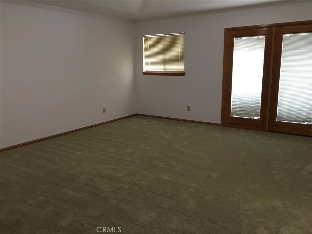 20231 Wadena Road Apple Valley, CA 92308 - Photo 9 of 20 an empty room with windows