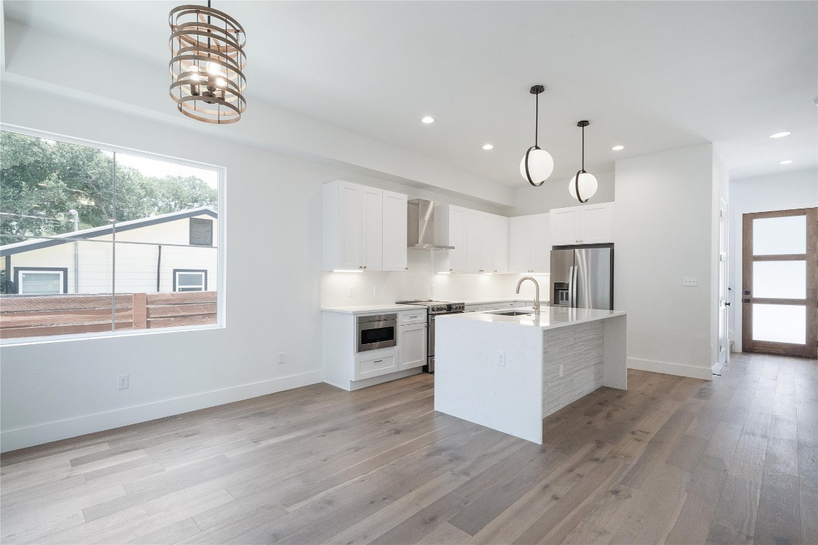 4805 Enchanted Lane, Unit 1 Austin, TX 78745 - Photo 11 of 29 a view of kitchen with window and wooden floor
