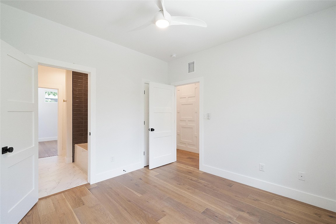 4805 Enchanted Lane, Unit 1 Austin, TX 78745 - Photo 16 of 29 a view of a bedroom with wooden floor