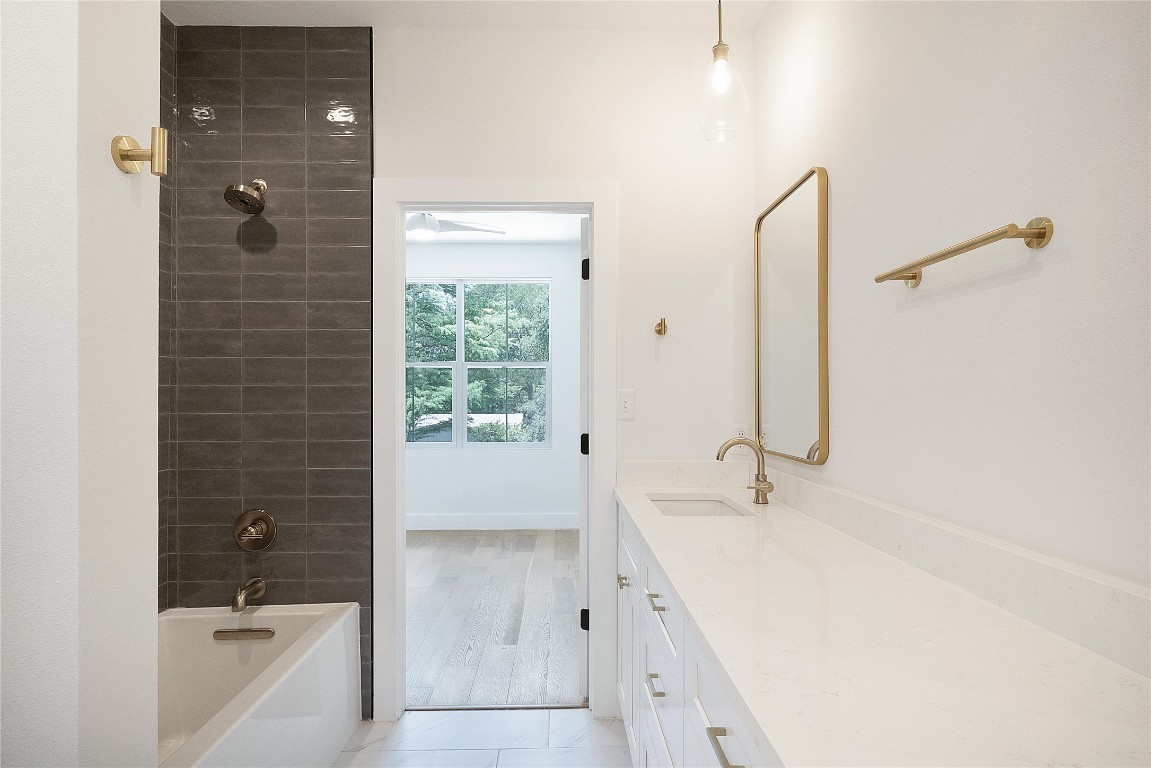 4805 Enchanted Lane, Unit 1 Austin, TX 78745 - Photo 18 of 29 a bathroom with a bathtub and a sink