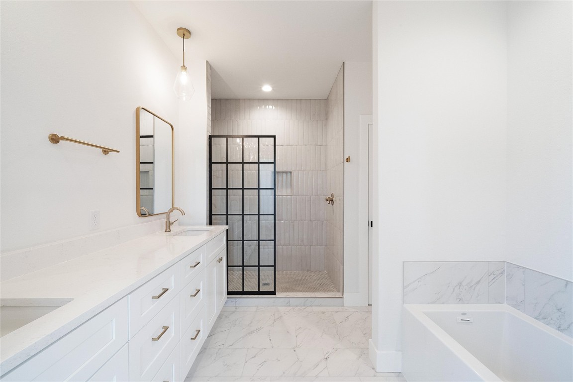 4805 Enchanted Lane, Unit 1 Austin, TX 78745 - Photo 24 of 29 a bathroom with a bathtub and a shower