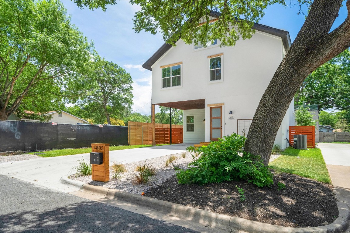 4805 Enchanted Lane, Unit 1 Austin, TX 78745 - Photo 3 of 29 a front view of a house with garden