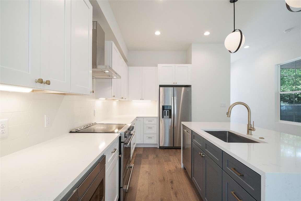4805 Enchanted Lane, Unit 1 Austin, TX 78745 - Photo 9 of 29 a kitchen with a sink a stove and refrigerator