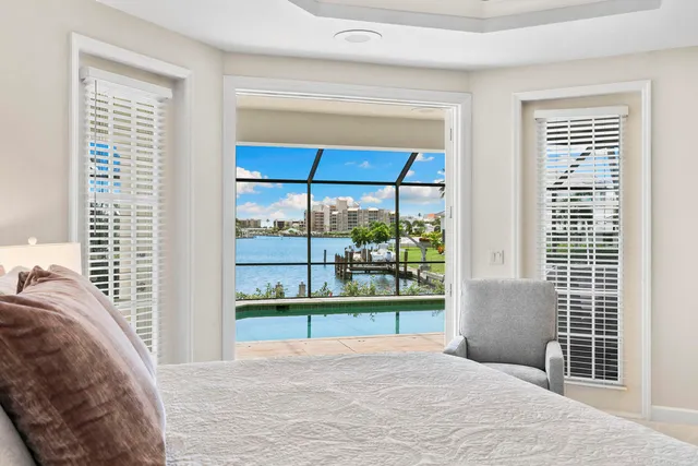 a spacious bathroom with a granite countertop tub sink and mirror