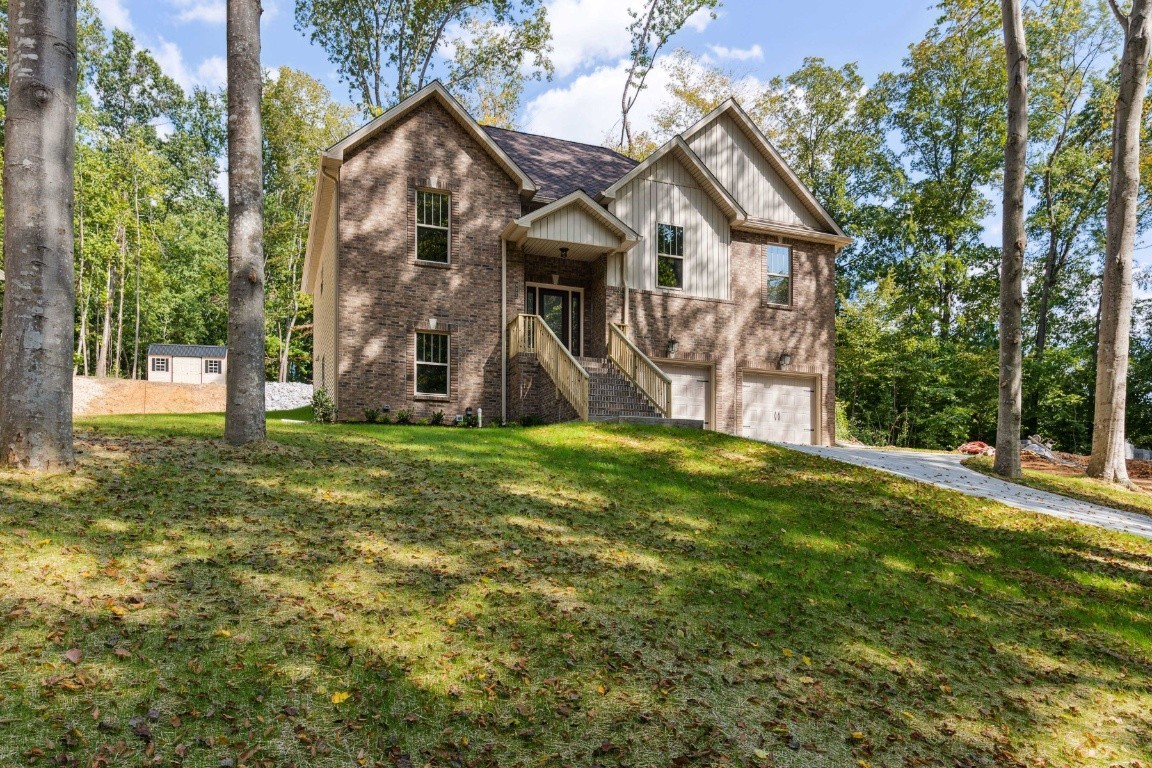 427 Jen Hollow Road Clarksville, TN 37040 - Photo 1 of 36 a front view of a house with a yard