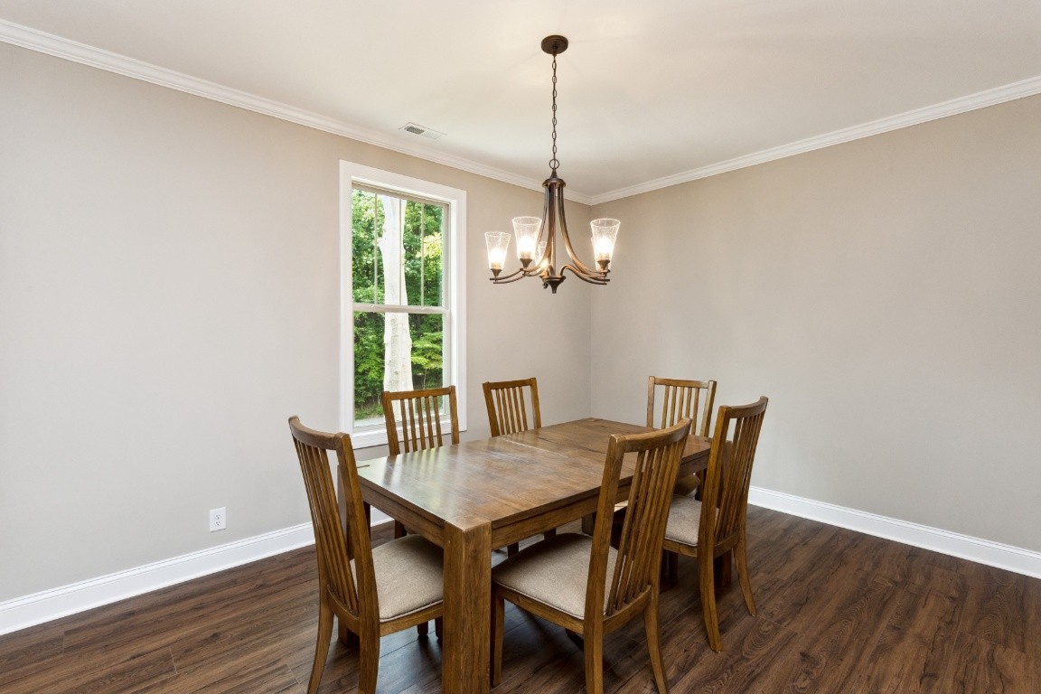 427 Jen Hollow Road Clarksville, TN 37040 - Photo 12 of 36 a view of a dining room with furniture window and wooden floor