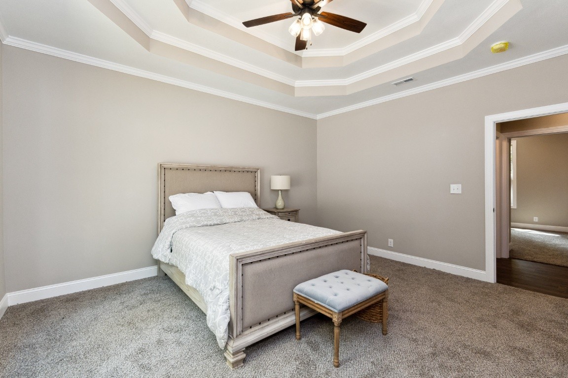 427 Jen Hollow Road Clarksville, TN 37040 - Photo 15 of 36 a bedroom with a bed and a ceiling fan