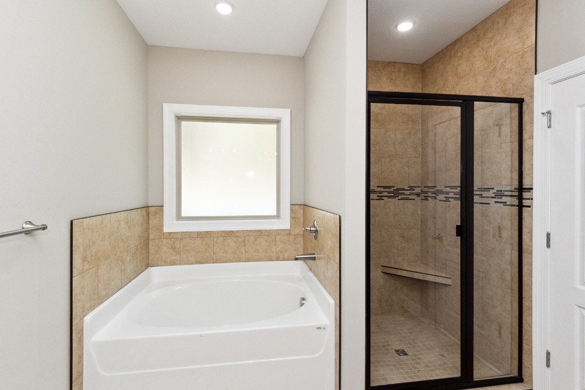 427 Jen Hollow Road Clarksville, TN 37040 - Photo 17 of 36 a bathroom with a tub and shower