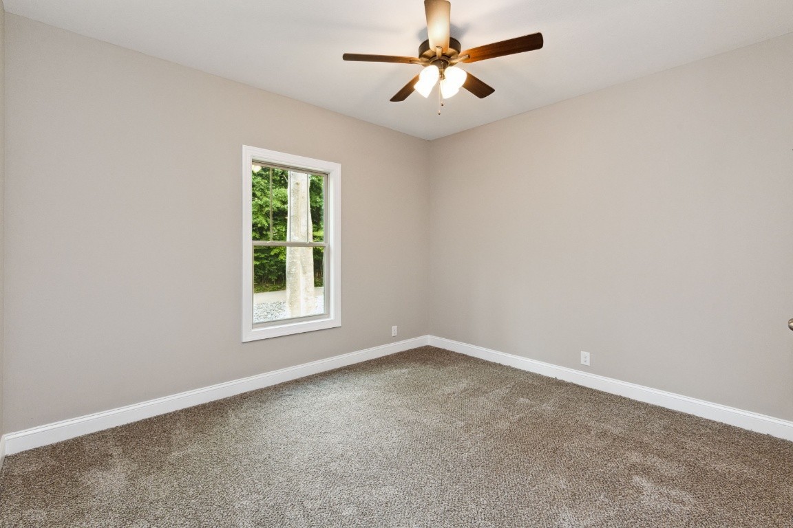 427 Jen Hollow Road Clarksville, TN 37040 - Photo 20 of 36 an empty room with a window and a fan
