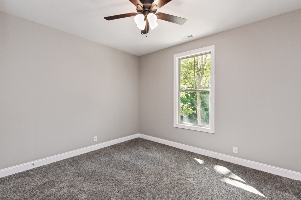 427 Jen Hollow Road Clarksville, TN 37040 - Photo 23 of 36 an empty room with a window and a fan