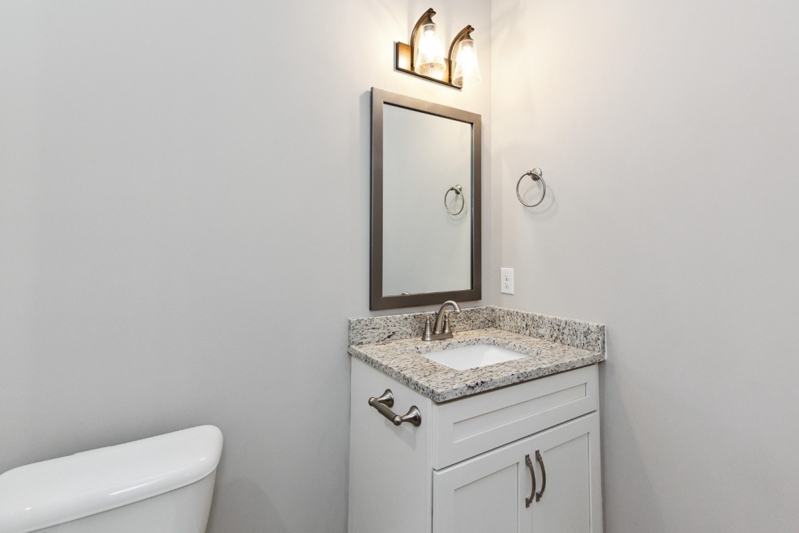 427 Jen Hollow Road Clarksville, TN 37040 - Photo 28 of 36 a bathroom with a granite countertop sink and a mirror