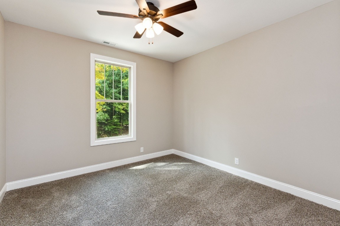 427 Jen Hollow Road Clarksville, TN 37040 - Photo 32 of 36 an empty room with a window and a fan