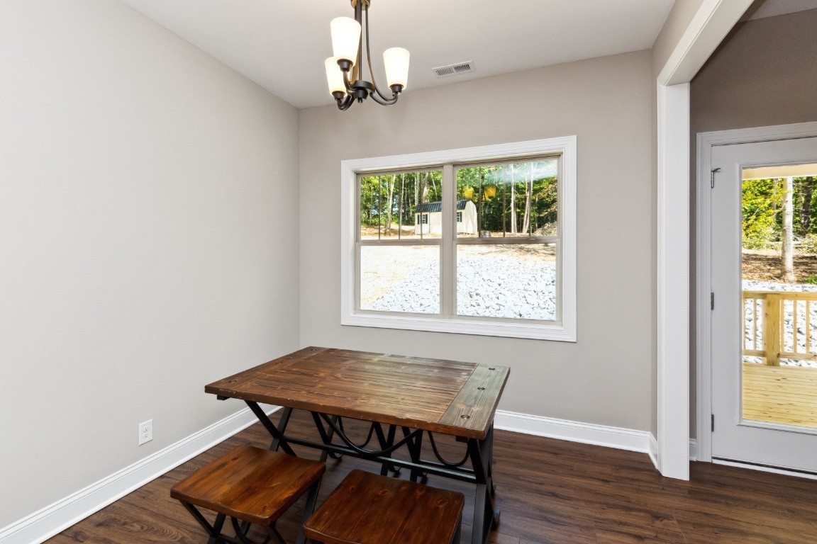 427 Jen Hollow Road Clarksville, TN 37040 - Photo 7 of 36 a view of a dining room with furniture window and wooden floor