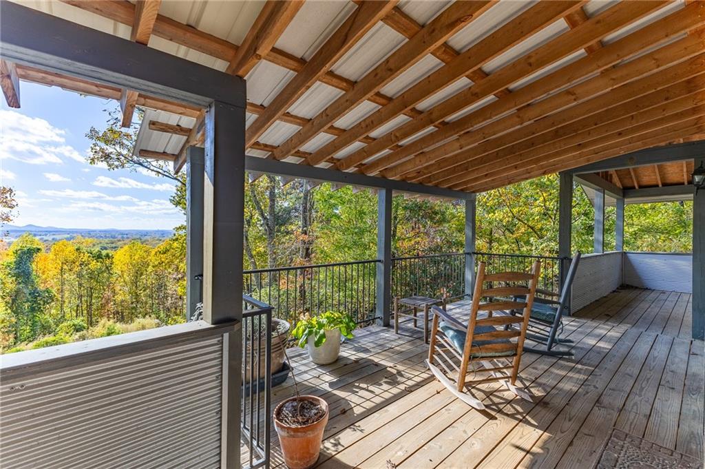 339 Cameron Road Cleveland, GA 30528 - Photo 11 of 36 a view of a patio with chairs and wooden floor